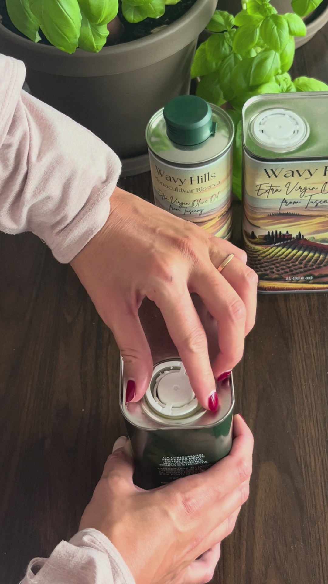 How to pull out the pourer spout in a metal can of olive oil